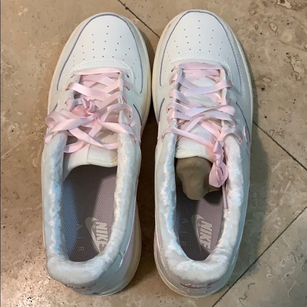 Nike Air Force One. White with light pink laces.